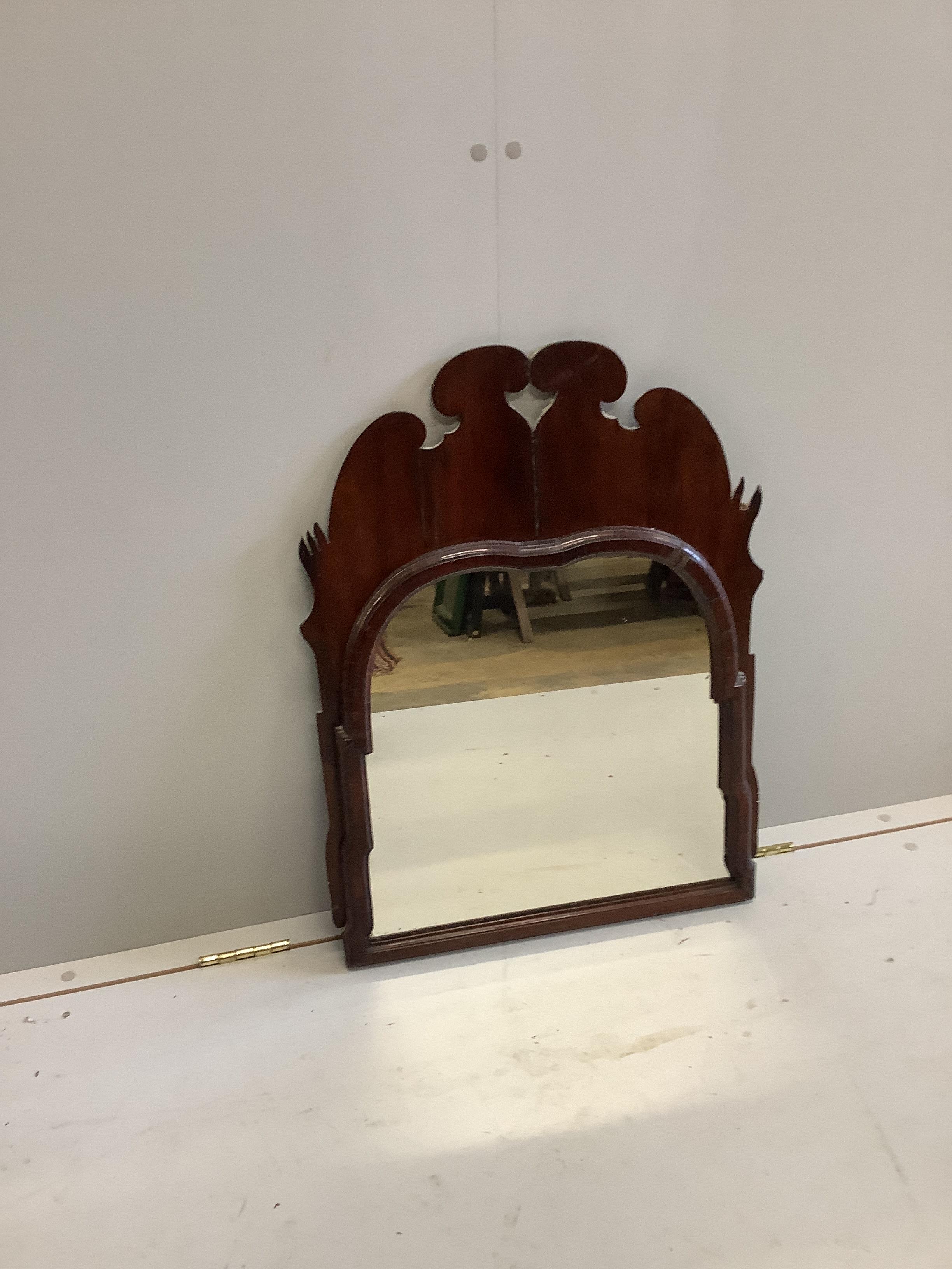 Two 18th century style walnut fret cut wall mirrors, largest width 55cm, height 70cm